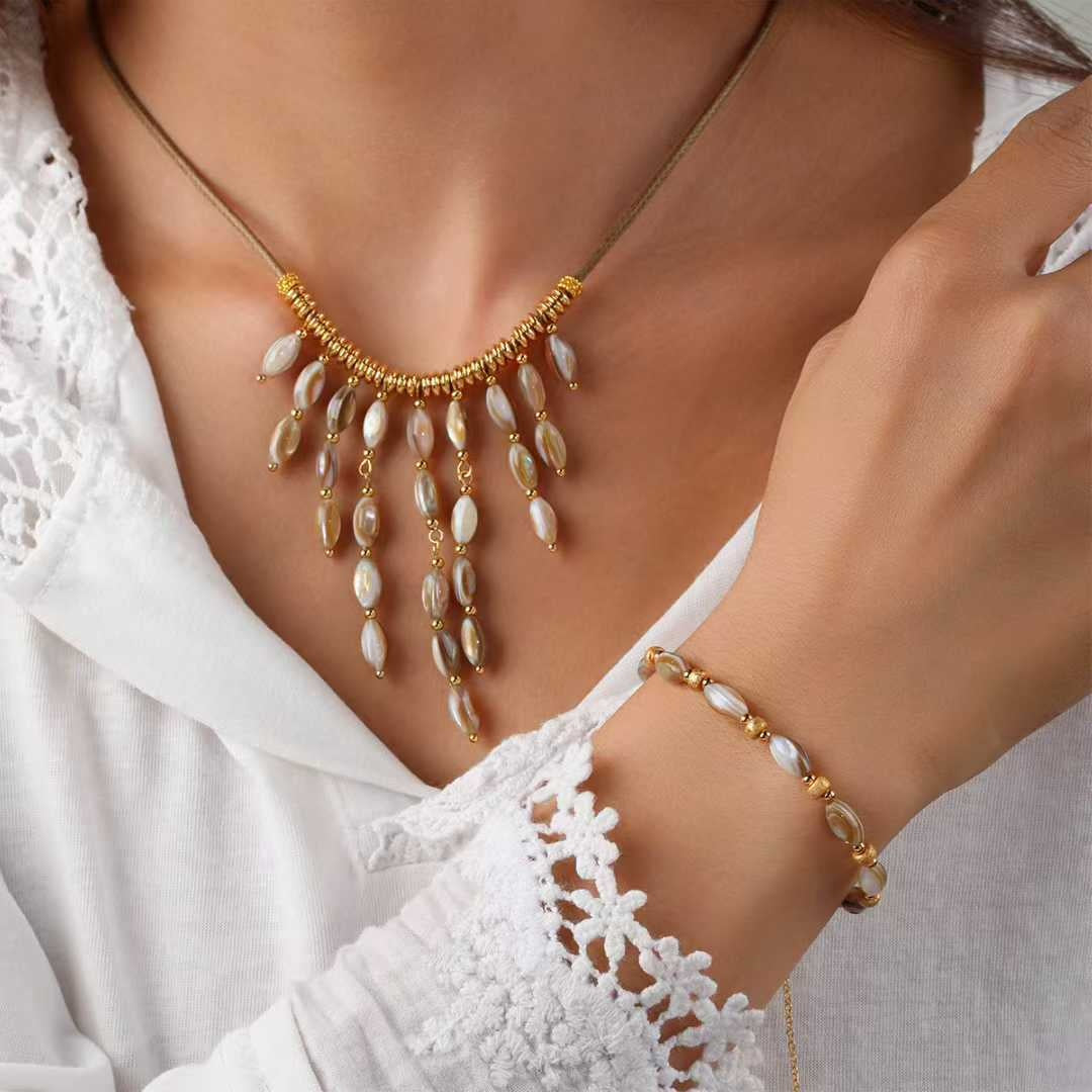 Cord & Shell Set necklace and bracelet, worn
