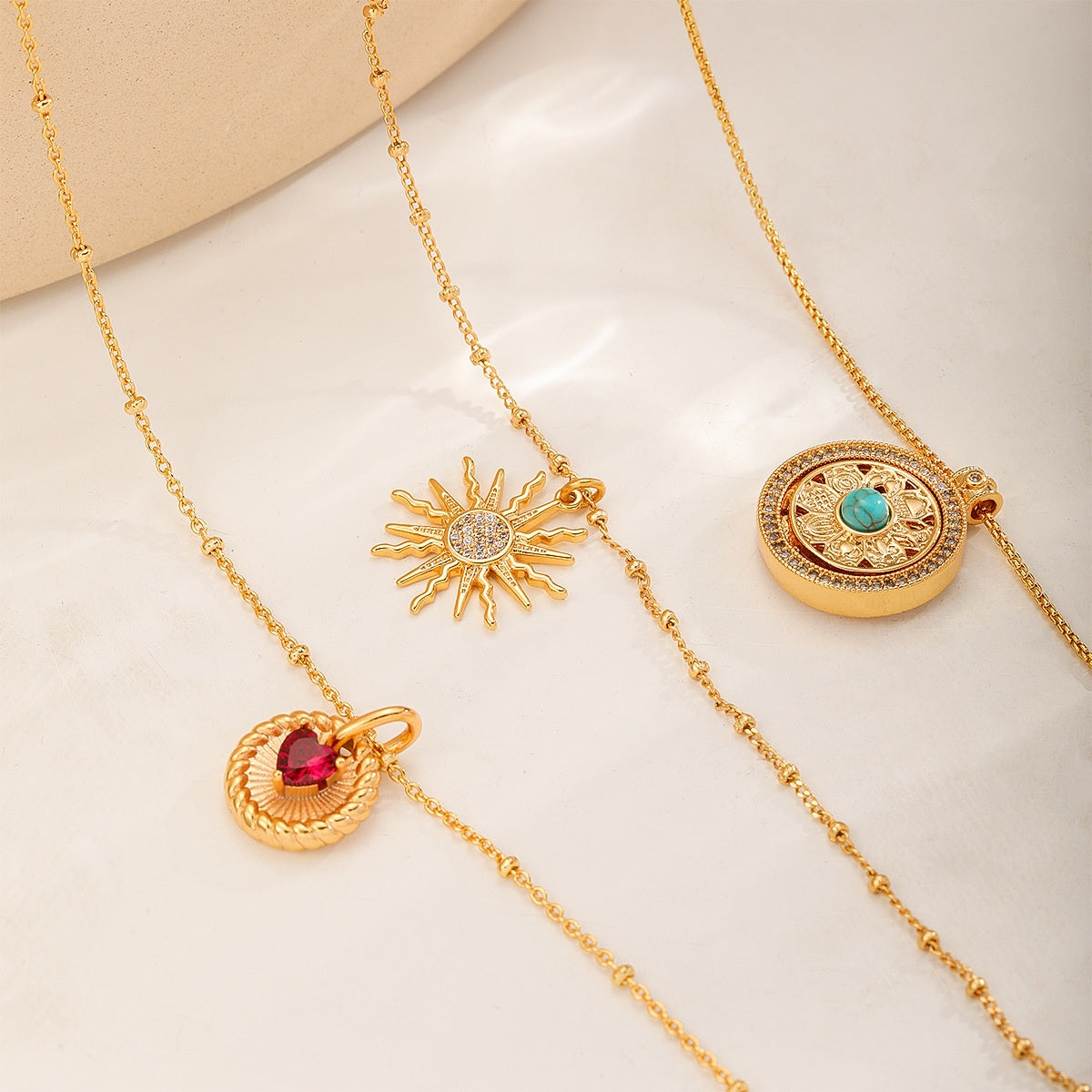 Fine Chain Pendant Necklace — Red Heart Disc, Crystal Sun and Blue Stone Medallion