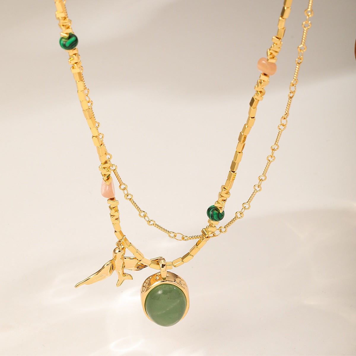 Gold Swallow Necklace — green side and tiger's eye side