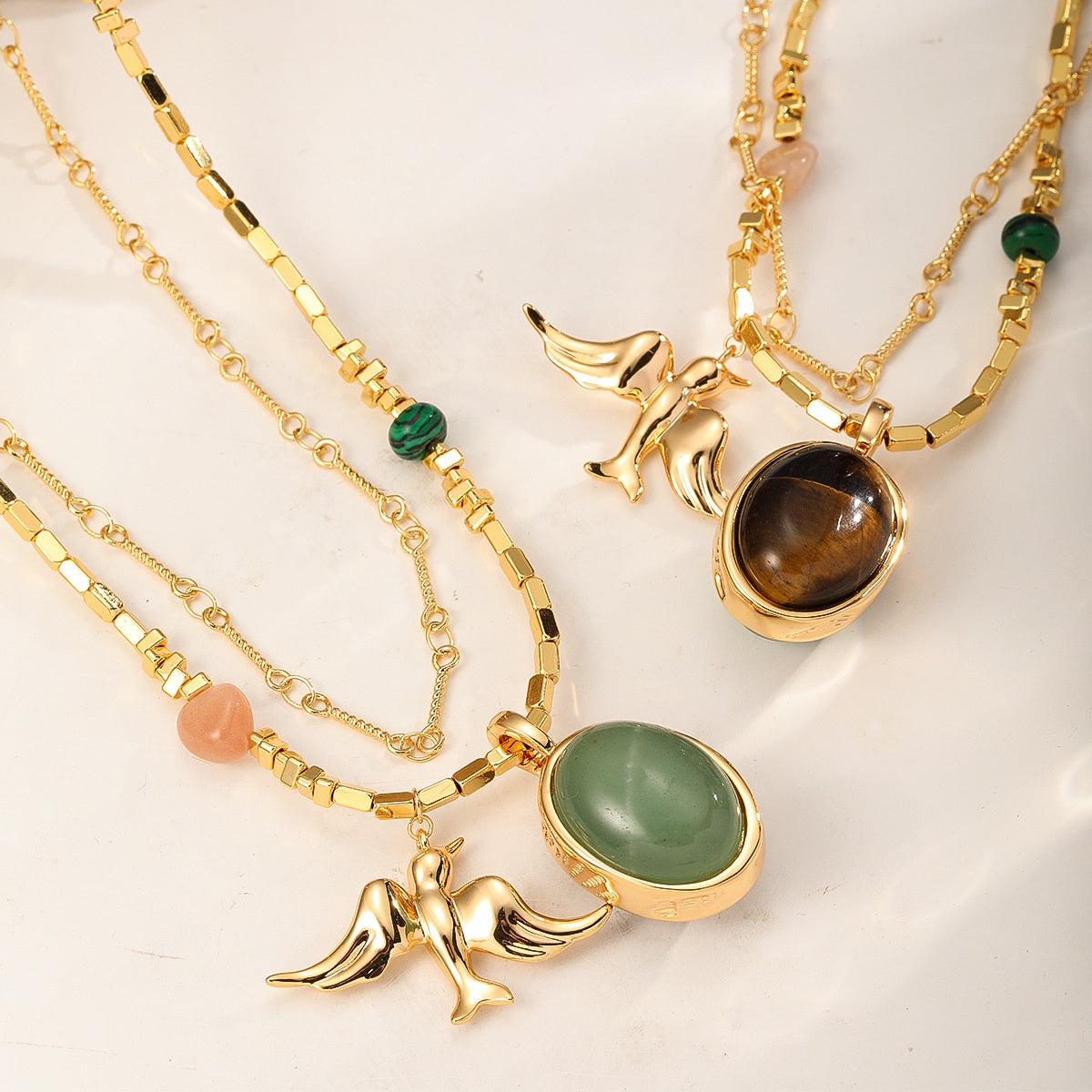 Gold Swallow Necklace — laid flat with clasp