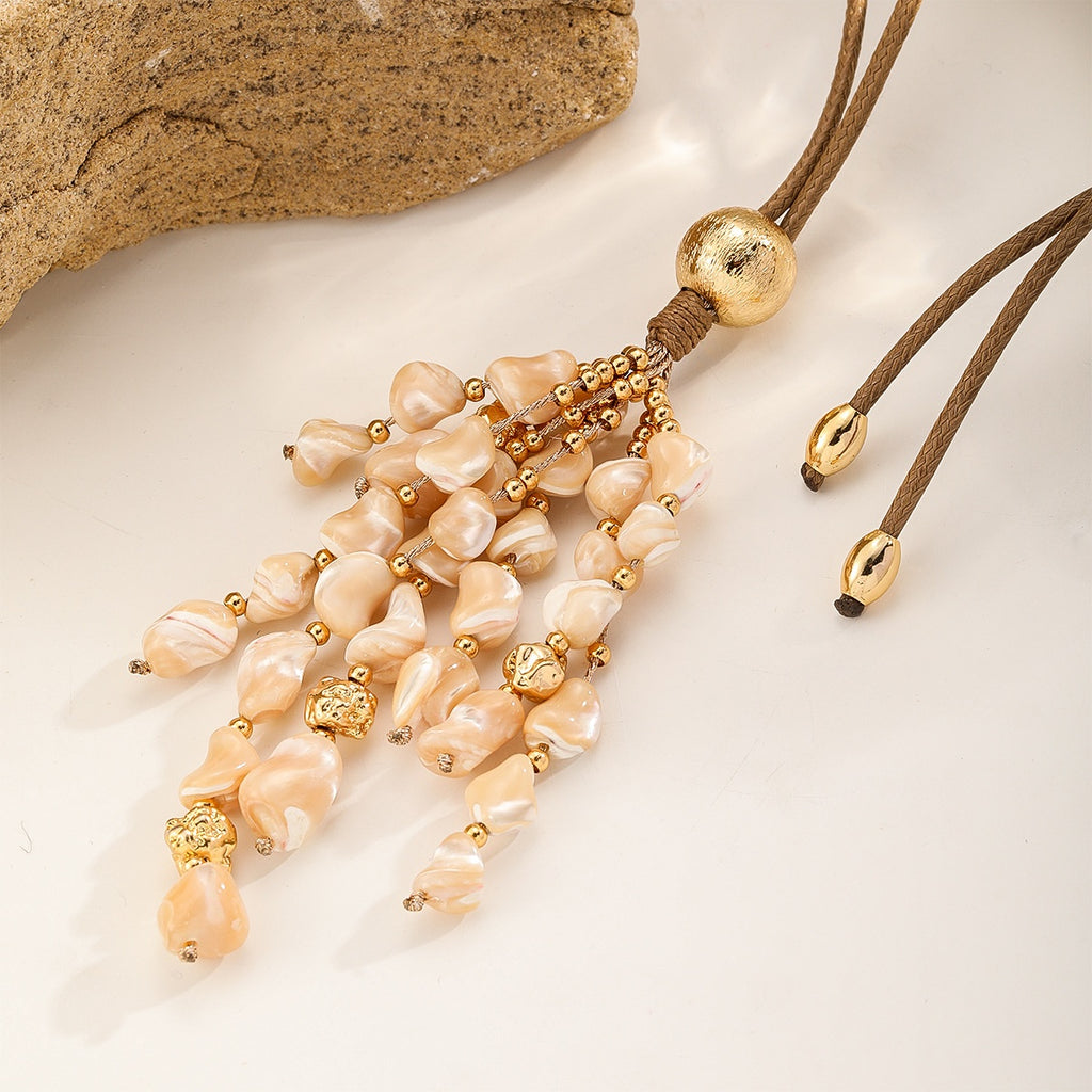 Shell Tassel Necklace — Peach Cream, tassel close-up