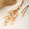 Shell Tassel Necklace — Peach Cream, tassel close-up