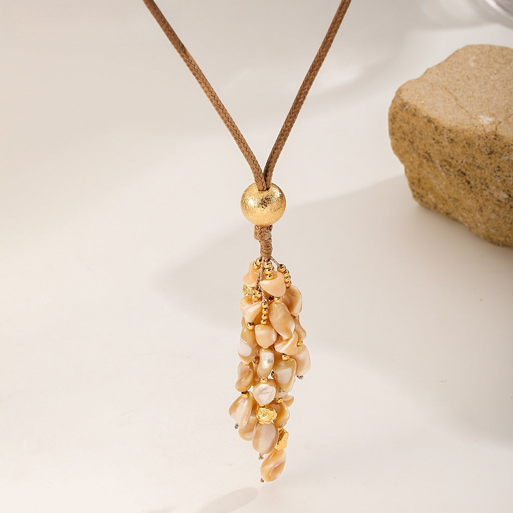 Shell Tassel Necklace — Peach Cream, hanging