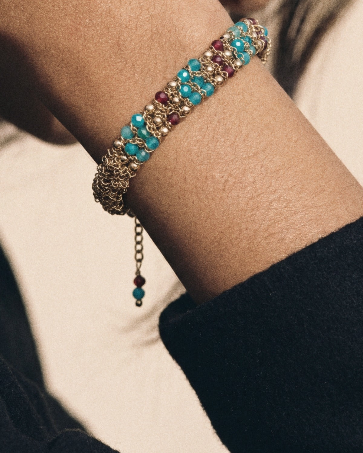 Golden Weave Bracelet in teal & garnet, worn