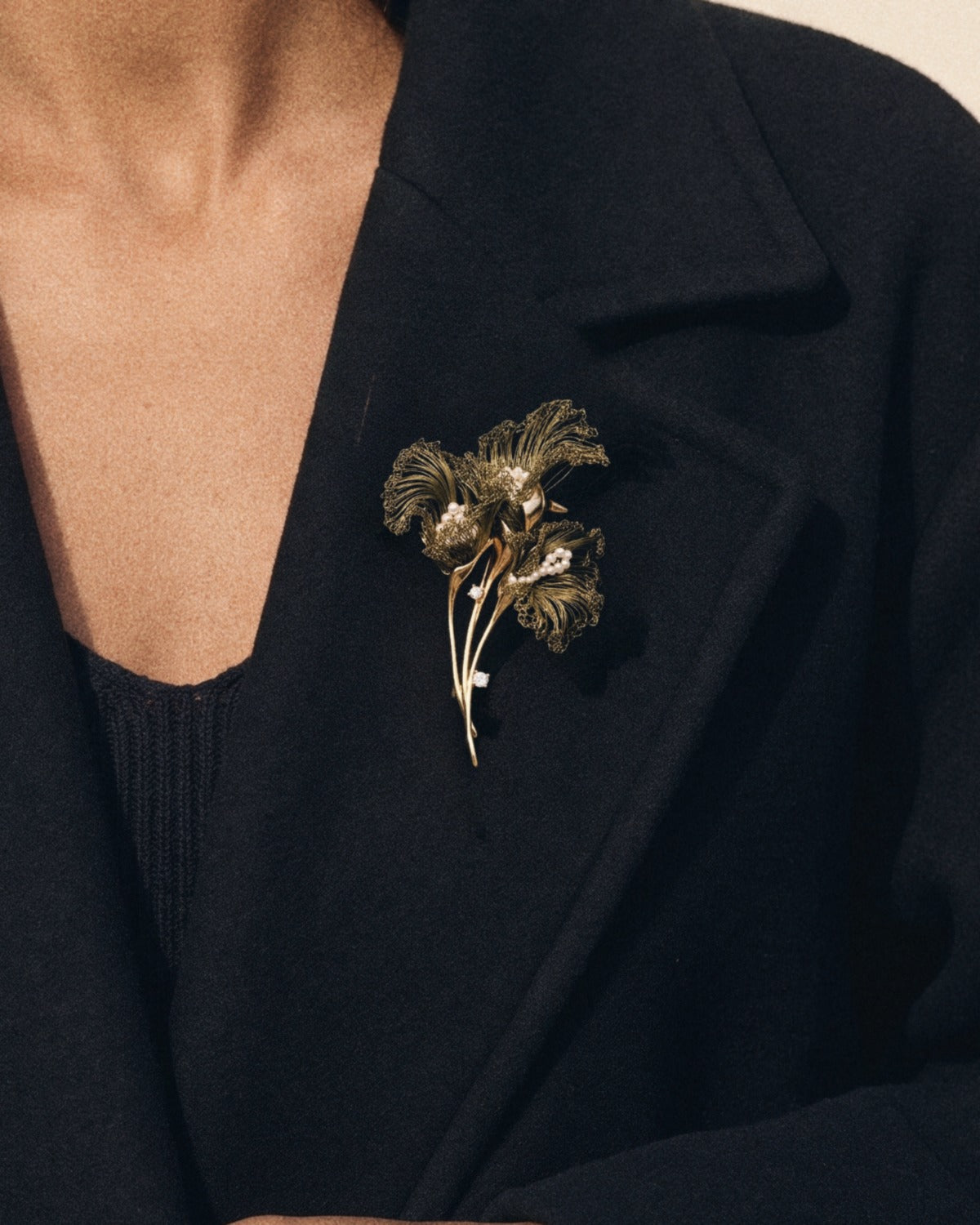 Olive Calla Brooch, worn on a coat lapel