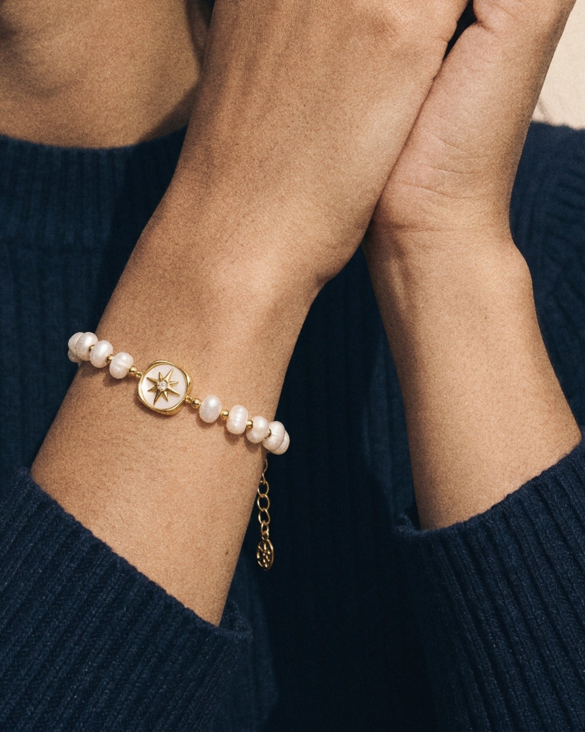 Pearl Charm Bracelet with the star charm, worn