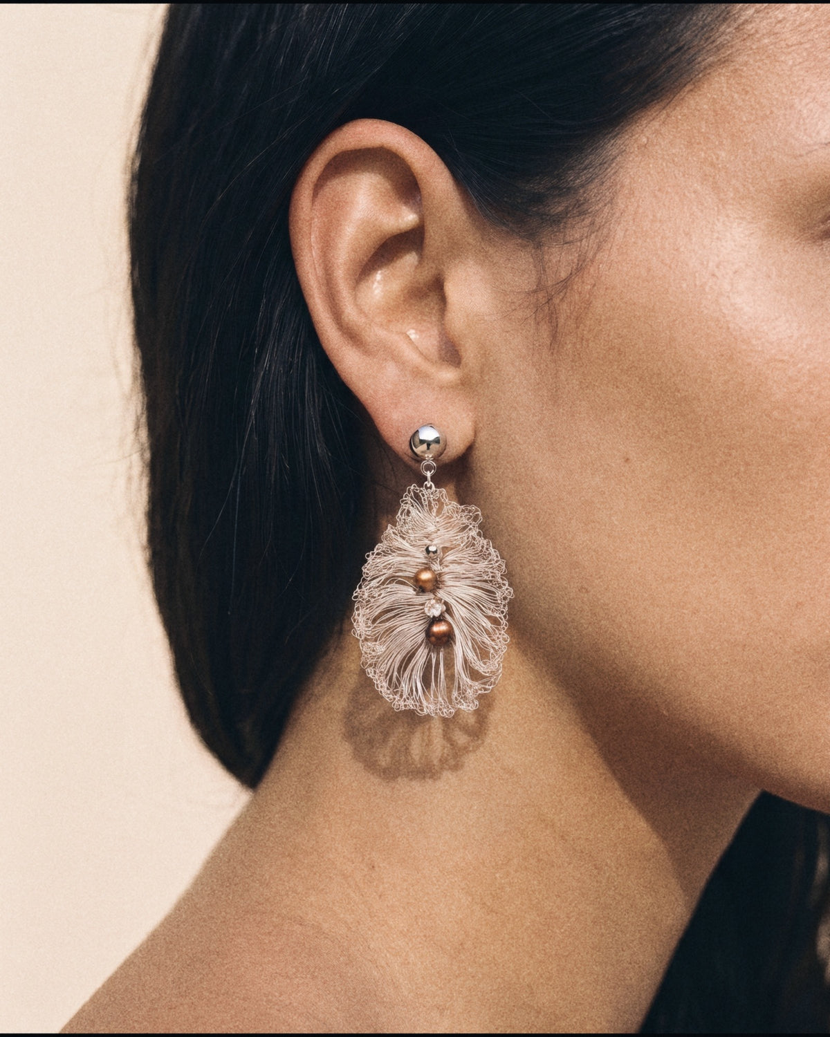 Seeded Leaf Earrings in silver, worn